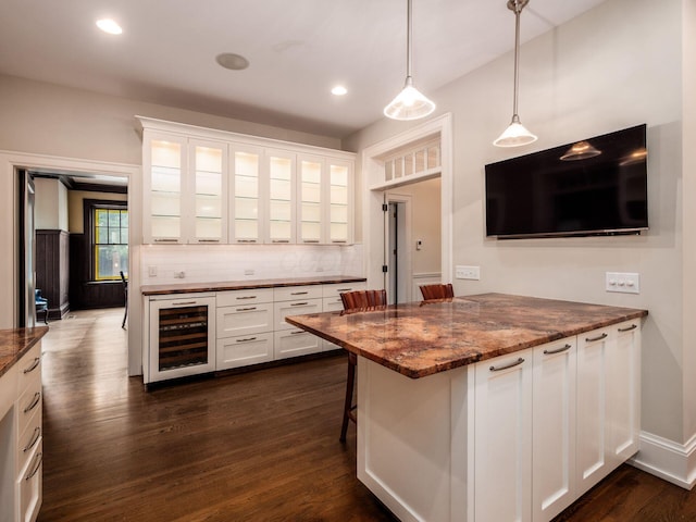 140 N Parkview Ave, Bexley, OH 43209 - kitchen featuring wine cooler, white cabinets, glass insert cabinets, tasteful backsplash, and dark wood-type flooring