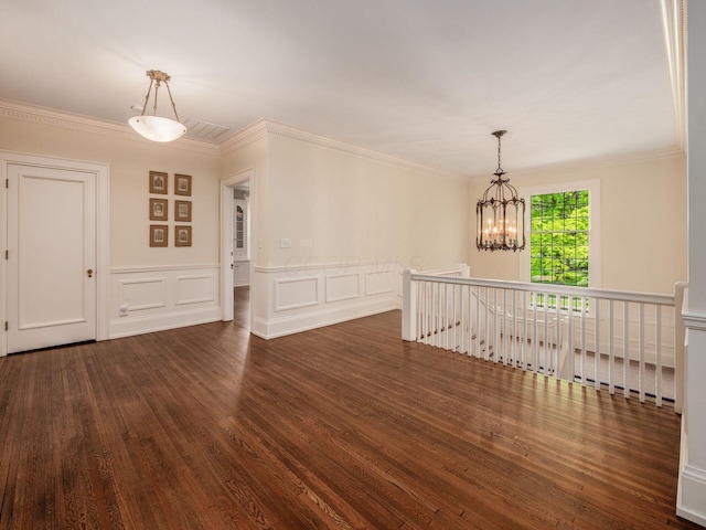 140 N Parkview Ave, Bexley, OH 43209 - unfurnished room featuring wood finished floors, a chandelier, ornamental molding, wainscoting, and a decorative wall