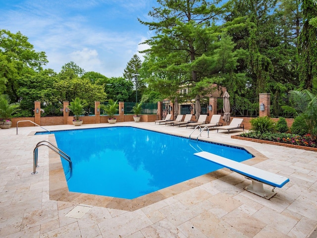 140 N Parkview Ave, Bexley, OH 43209 - view of swimming pool with a patio area, view of scattered trees, and a diving board