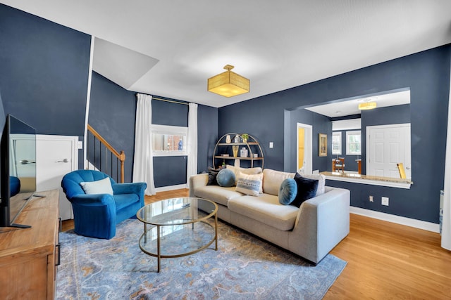 609 Mohawk St, Columbus, OH 43206 - living area featuring wood finished floors, baseboards, and stairs