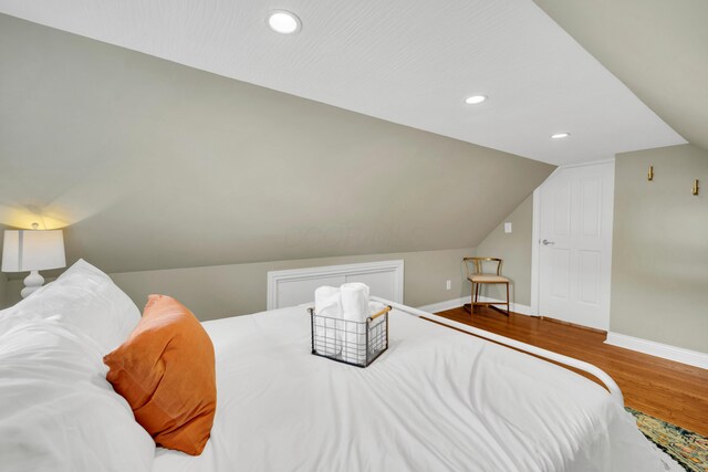 609 Mohawk St, Columbus, OH 43206 - bedroom with baseboards, wood finished floors, vaulted ceiling, and recessed lighting