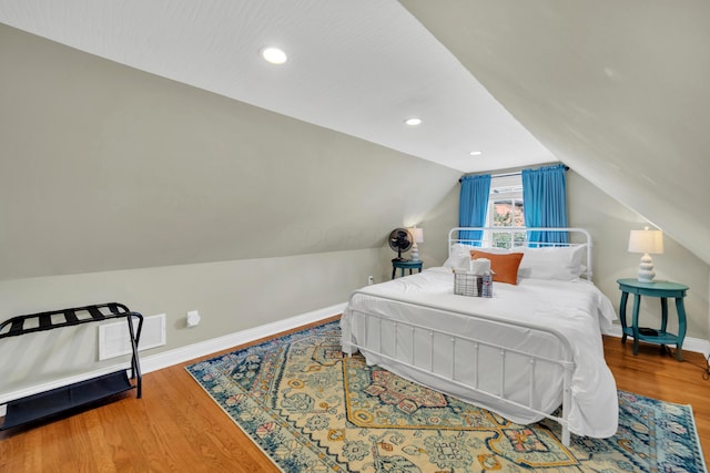 609 Mohawk St, Columbus, OH 43206 - bedroom with wood finished floors, baseboards, lofted ceiling, and recessed lighting