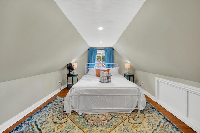 609 Mohawk St, Columbus, OH 43206 - bedroom with wood finished floors, baseboards, and vaulted ceiling