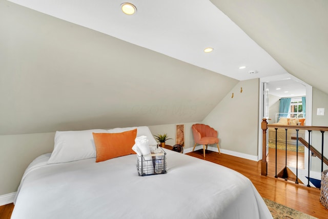 609 Mohawk St, Columbus, OH 43206 - bedroom featuring baseboards, wood finished floors, vaulted ceiling, and recessed lighting