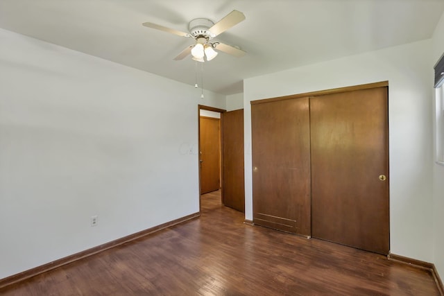 1950-1952 Bairsford Dr, Columbus, OH 43232 - unfurnished bedroom featuring a closet, dark wood-style flooring, and baseboards
