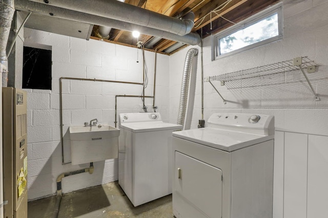 1950-1952 Bairsford Dr, Columbus, OH 43232 - clothes washing area featuring separate washer and dryer and concrete block wall