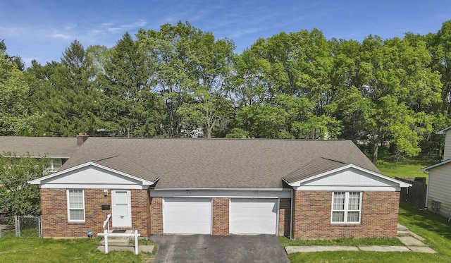 1950-1952 Bairsford Dr, Columbus, OH 43232 - ranch-style home with an attached garage, driveway, brick siding, and a shingled roof