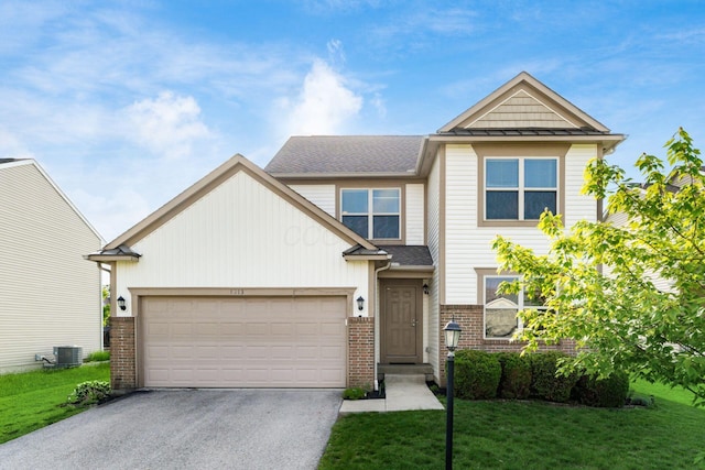 view of front facade with driveway, brick siding, central AC, a front yard, and an attached garage