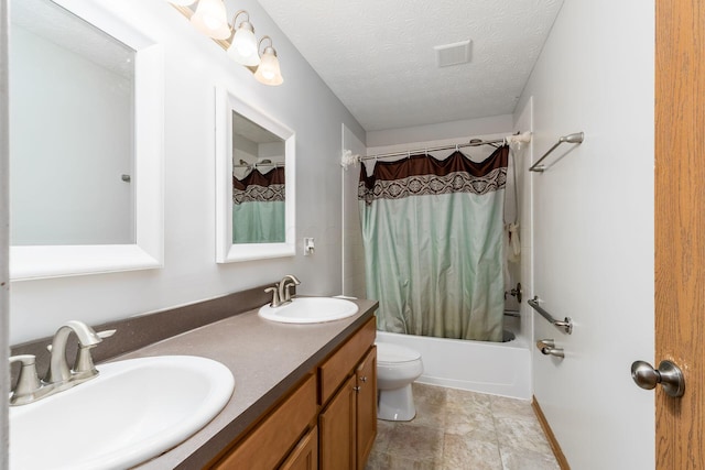 bathroom featuring shower / tub combo, double vanity, toilet, and a textured ceiling