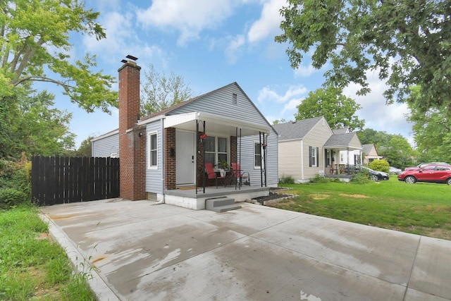 523 S Napoleon Ave, Columbus, OH 43213 - view of front of property featuring a porch, a chimney, and brick siding