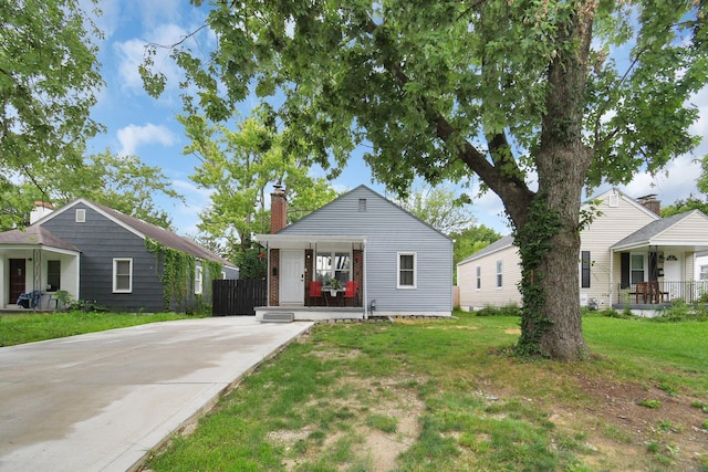 523 S Napoleon Ave, Columbus, OH 43213 - shotgun-style home featuring a porch and a chimney