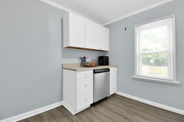 523 S Napoleon Ave, Columbus, OH 43213 - kitchen featuring crown molding, healthy amount of natural light, wood finished floors, baseboards, and white cabinets