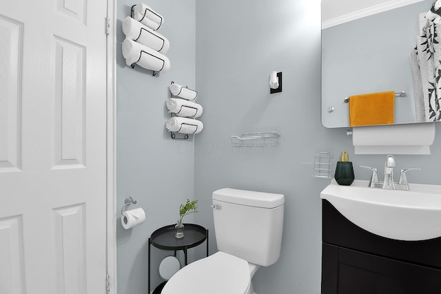 523 S Napoleon Ave, Columbus, OH 43213 - half bathroom featuring toilet, vanity, and crown molding