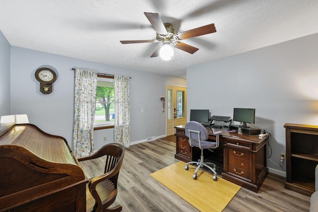 214 Sylvan Dr, Delaware, OH 43015 - office with a ceiling fan, wood finished floors, baseboards, and a textured ceiling