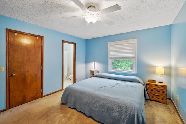 214 Sylvan Dr, Delaware, OH 43015 - carpeted bedroom with baseboards, a textured ceiling, and a ceiling fan