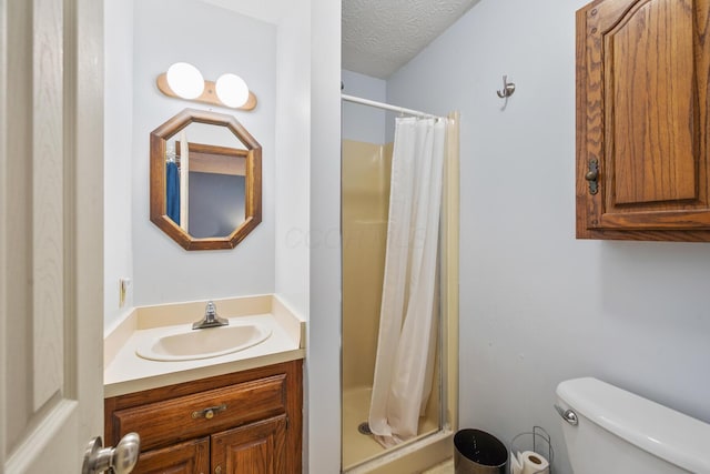 214 Sylvan Dr, Delaware, OH 43015 - bathroom featuring a stall shower, toilet, vanity, and a textured ceiling