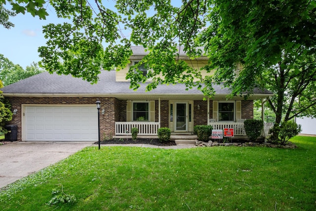 214 Sylvan Dr, Delaware, OH 43015 - view of front of property featuring a porch, a garage, concrete driveway, a front yard, and brick siding