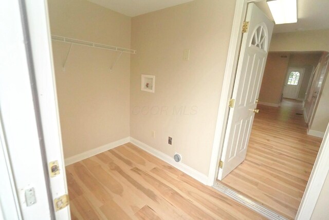 723 N Maple St, Lancaster, OH 43130 - clothes washing area with washer hookup, light wood-type flooring, and baseboards