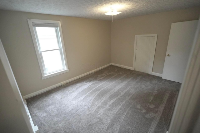 723 N Maple St, Lancaster, OH 43130 - carpeted spare room with a textured ceiling and baseboards