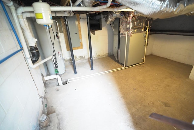 723 N Maple St, Lancaster, OH 43130 - unfinished below grade area featuring electric panel, heating unit, concrete block wall, and water heater