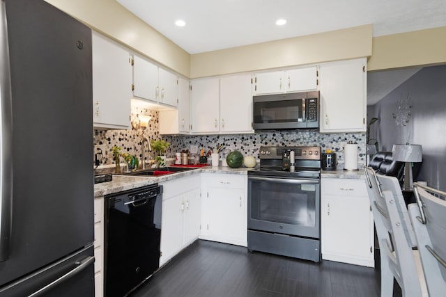 5309 Trillium Ct, Columbus, OH 43230 - kitchen with appliances with stainless steel finishes, a sink, light countertops, backsplash, and white cabinets