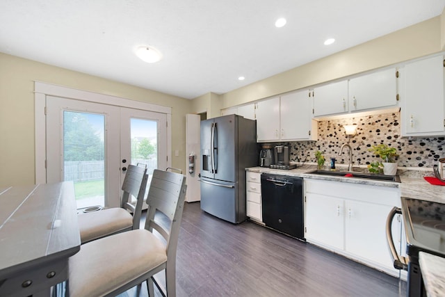 5309 Trillium Ct, Columbus, OH 43230 - kitchen with stainless steel appliances, light countertops, a sink, backsplash, and french doors