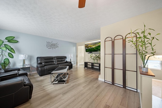 5309 Trillium Ct, Columbus, OH 43230 - living room featuring wood finished floors, a textured ceiling, ceiling fan, and baseboards