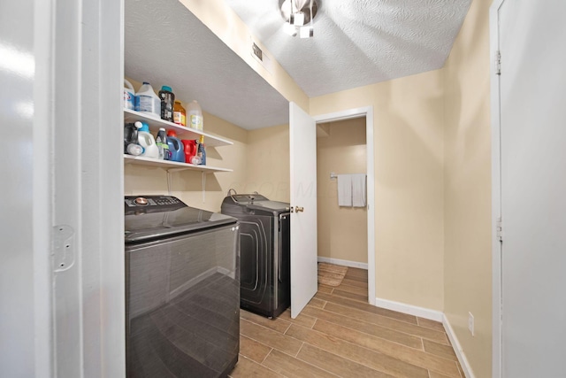 5309 Trillium Ct, Columbus, OH 43230 - washroom featuring washer and clothes dryer, wood tiled floors, and baseboards