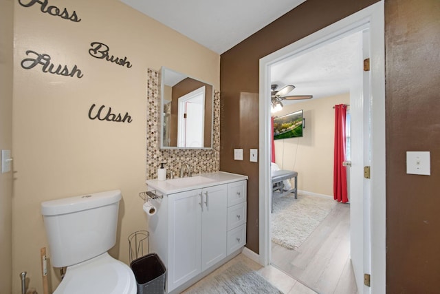 5309 Trillium Ct, Columbus, OH 43230 - ensuite bathroom with vanity, ceiling fan, toilet, wood finished floors, and baseboards