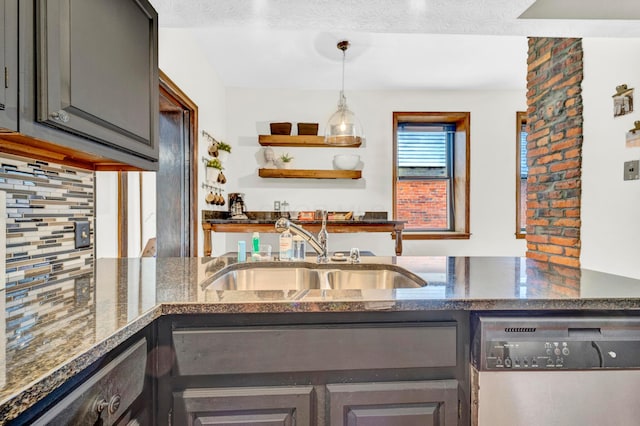 606 S 9th St, Columbus, OH 43206 - kitchen featuring dishwasher, a sink, dark stone countertops, and backsplash