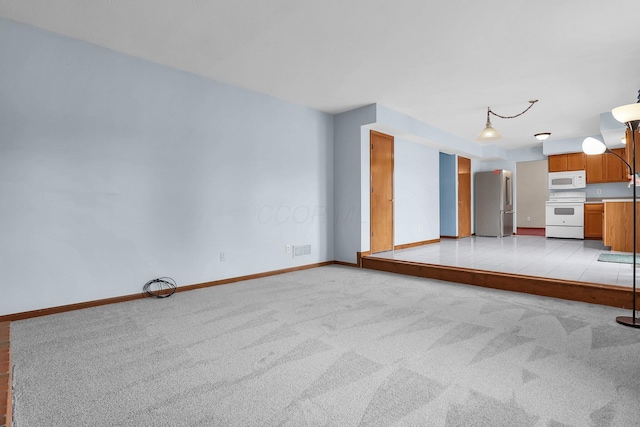 255 Oakview Ct, Pickerington, OH 43147 - unfurnished living room featuring light carpet and baseboards