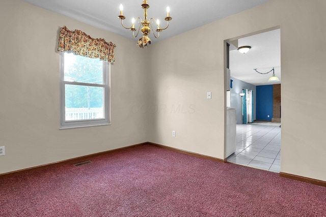 255 Oakview Ct, Pickerington, OH 43147 - carpeted empty room with a chandelier, baseboards, and tile patterned floors
