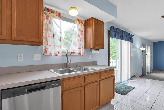 255 Oakview Ct, Pickerington, OH 43147 - kitchen with stainless steel dishwasher, a sink, light countertops, light tile patterned floors, and brown cabinets