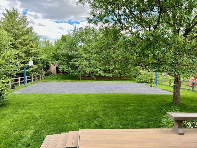 view of yard featuring basketball court