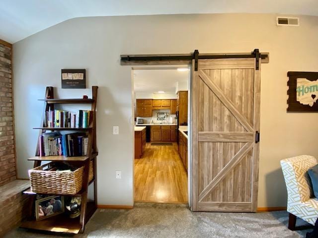 281 Bexford Rd, West Jefferson, OH 43162 - living area featuring lofted ceiling, baseboards, and light colored carpet