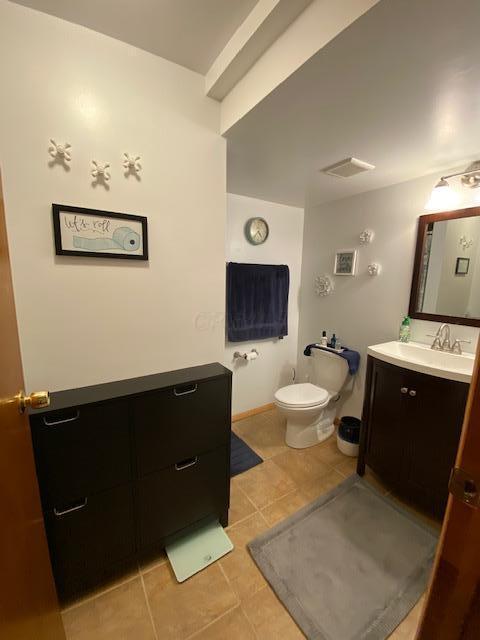 281 Bexford Rd, West Jefferson, OH 43162 - half bathroom featuring tile patterned floors, vanity, and toilet