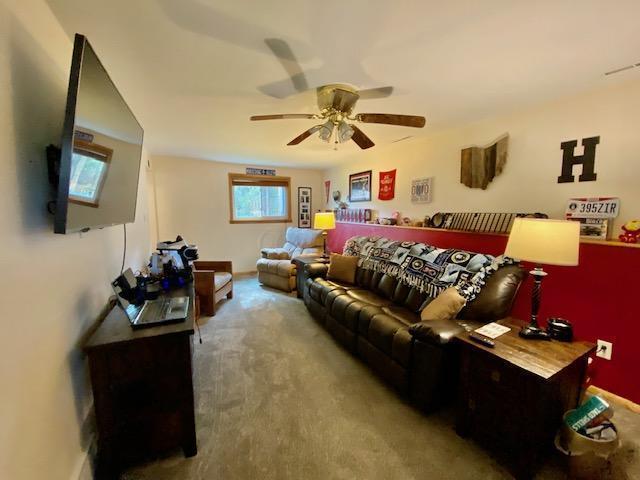 281 Bexford Rd, West Jefferson, OH 43162 - carpeted living area with a ceiling fan
