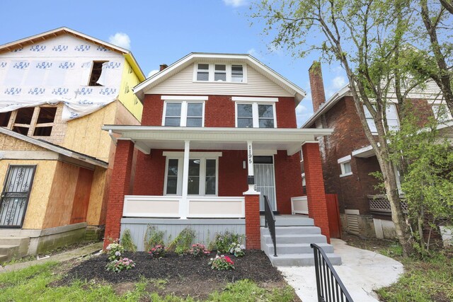 1195 E Whittier St, Columbus, OH 43206 - view of front of home featuring a porch and brick siding