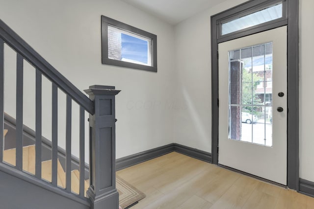 1195 E Whittier St, Columbus, OH 43206 - entryway with light wood-style flooring, healthy amount of natural light, and stairs
