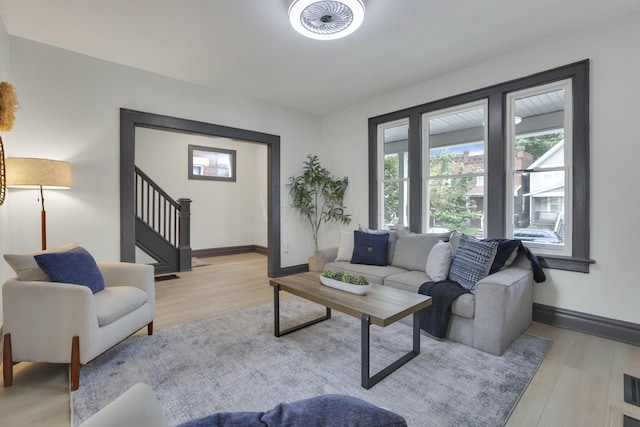 1195 E Whittier St, Columbus, OH 43206 - living room with wood finished floors, stairs, and baseboards