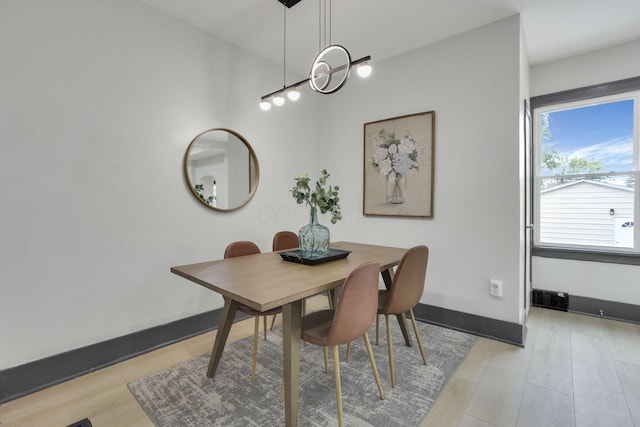 1195 E Whittier St, Columbus, OH 43206 - dining room with light wood-type flooring and baseboards