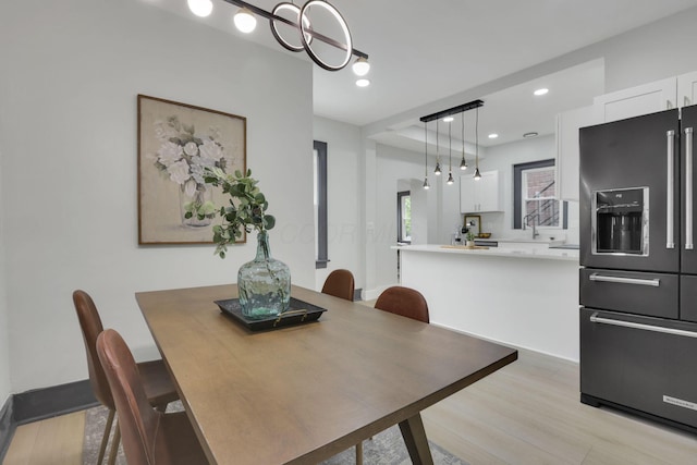 1195 E Whittier St, Columbus, OH 43206 - dining room featuring light wood-style flooring and recessed lighting