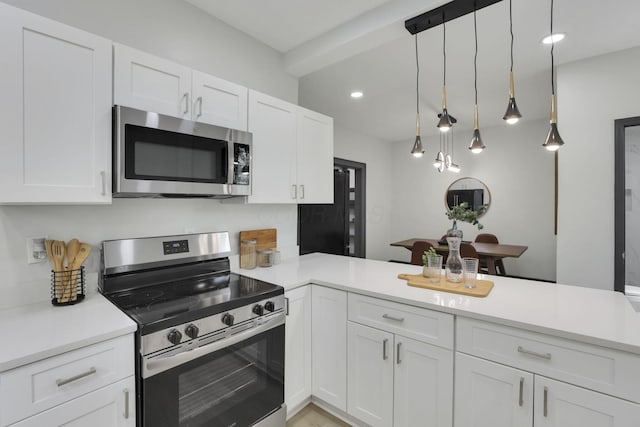 1195 E Whittier St, Columbus, OH 43206 - kitchen featuring appliances with stainless steel finishes, white cabinets, light countertops, and recessed lighting