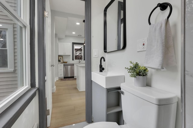1195 E Whittier St, Columbus, OH 43206 - bathroom featuring wood finished floors, toilet, recessed lighting, and vanity
