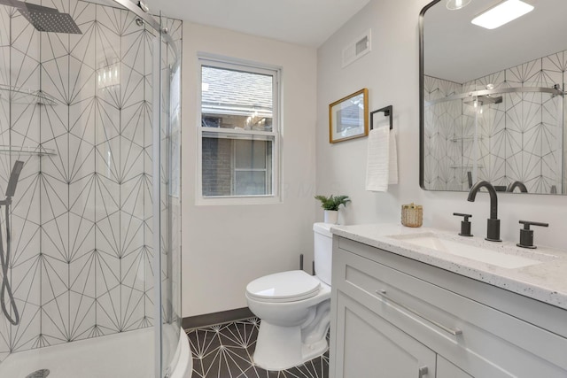 1195 E Whittier St, Columbus, OH 43206 - bathroom with vanity, a stall shower, toilet, and tile patterned flooring