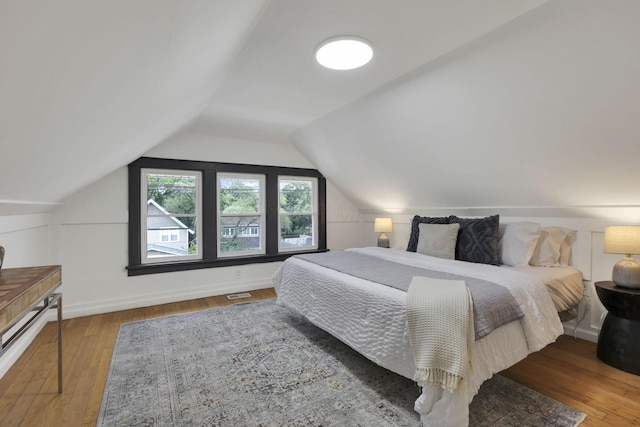 1195 E Whittier St, Columbus, OH 43206 - bedroom featuring wood-type flooring and vaulted ceiling