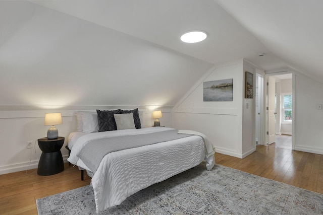 1195 E Whittier St, Columbus, OH 43206 - bedroom featuring wood-type flooring, lofted ceiling, and baseboards