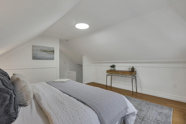 1195 E Whittier St, Columbus, OH 43206 - bedroom featuring wood finished floors and vaulted ceiling