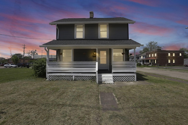 841 Saint Clair Ave, Columbus, OH 43201 - view of front of home with a porch, a front yard, a shingled roof, and a chimney