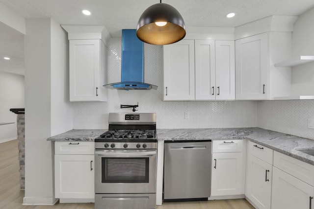 841 Saint Clair Ave, Columbus, OH 43201 - kitchen featuring stainless steel appliances, open shelves, wall chimney range hood, white cabinets, and recessed lighting